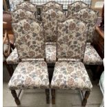 A set of eight 20th century oak dining chairs with floral tapestry upholstery