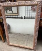 A large gilt decorated wall mirror,