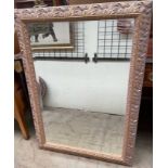 A large gilt decorated wall mirror,