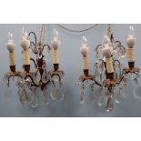 A pair of gilt metal three branch lustre drop wall lights,