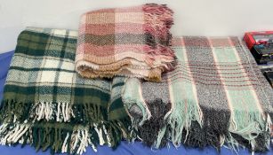 Three woolen blankets