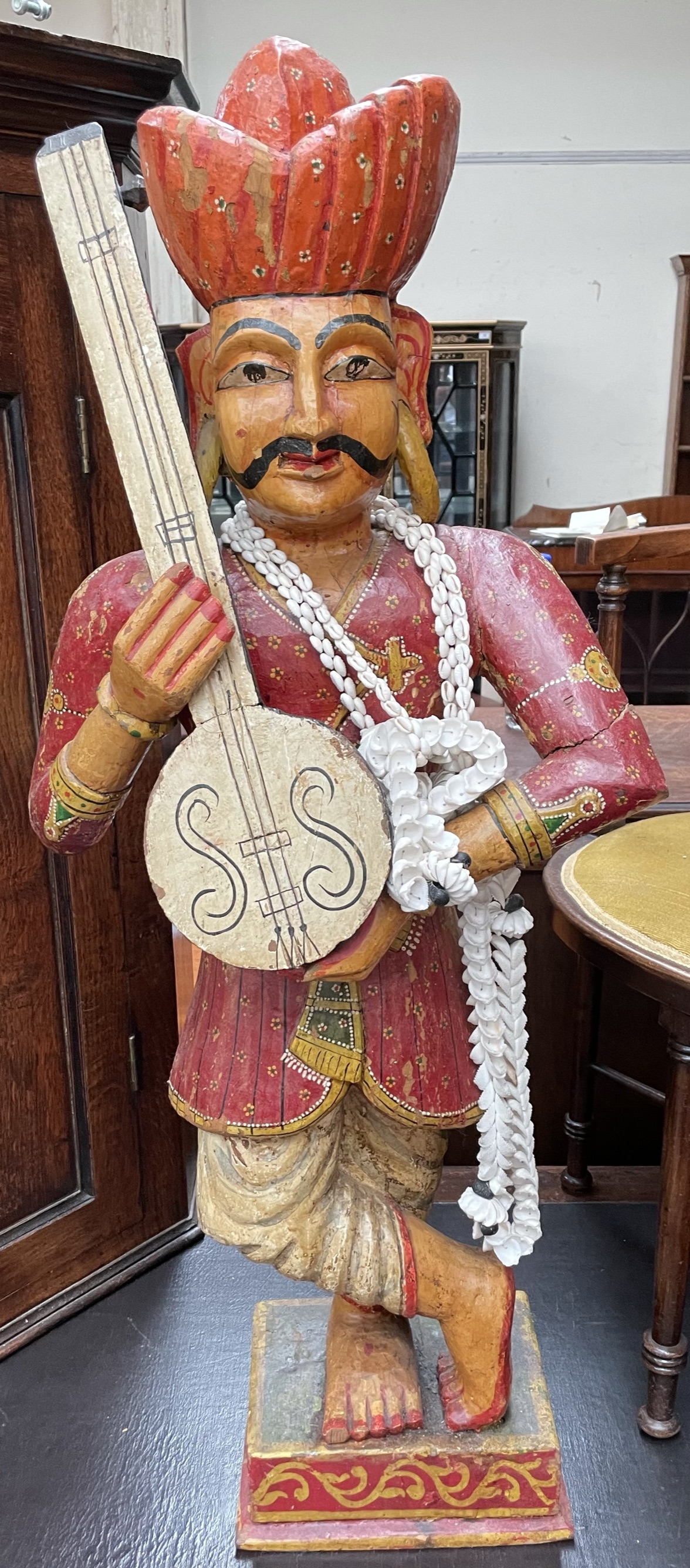 An Indian carved and painted figure,