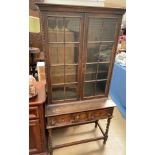 A 20th century oak display cabinet,