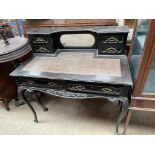 A late Victorian ebonised lady's writing desk, the raised back with a mirror and drawers,