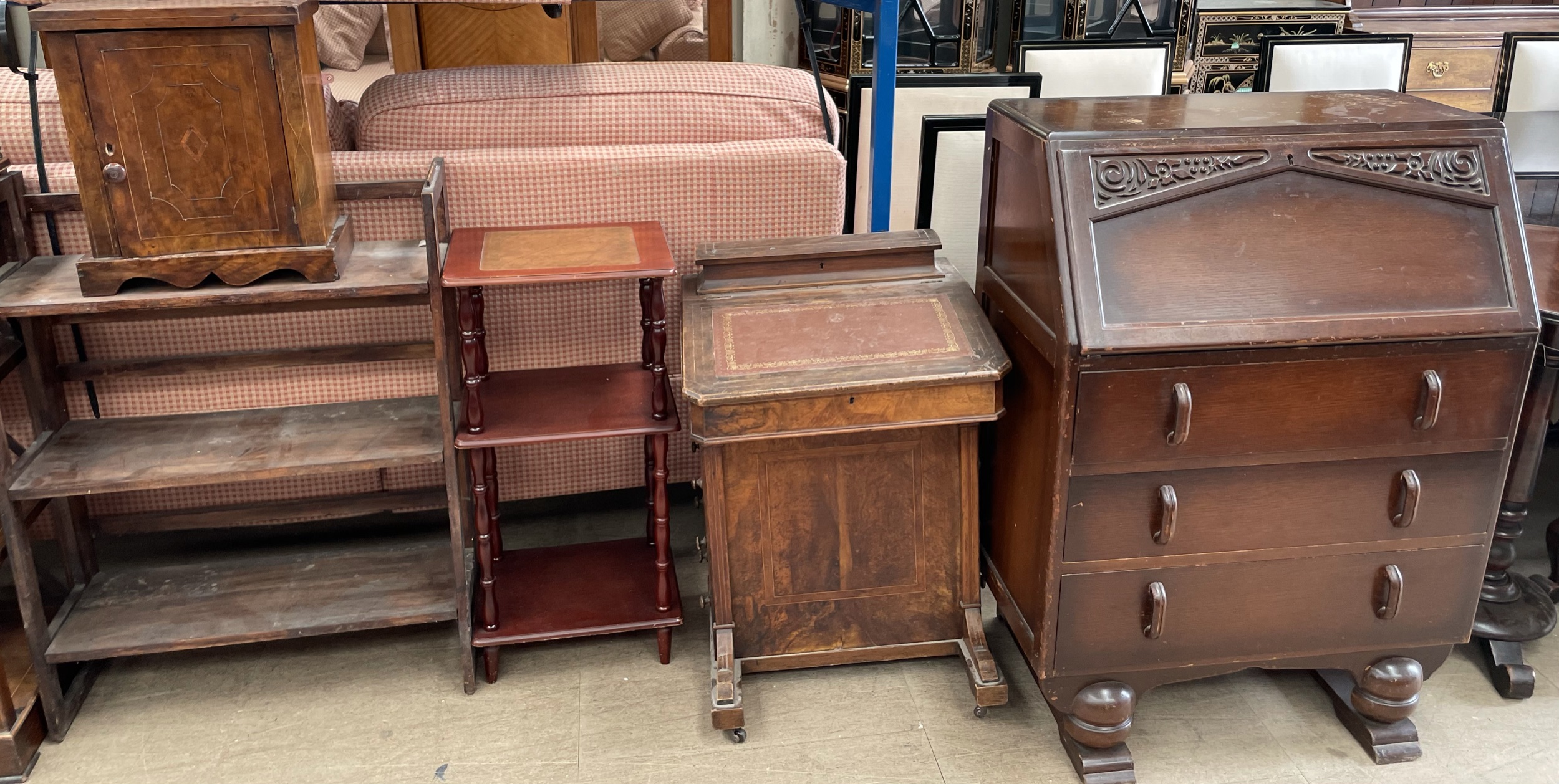 A Victorian walnut Davenport together with an oak bureau, bookcase,