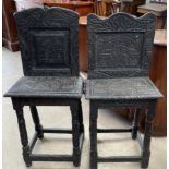 A matched pair of carved ebonised back stools,