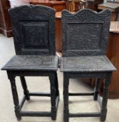 A matched pair of carved ebonised back stools,