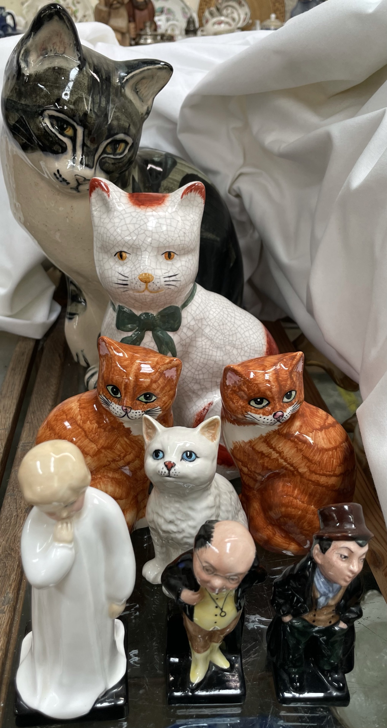 A Studio Six model of a cat designed by Seneshall, together with a pair of Babbacombe pottery cats,