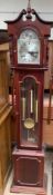A reproduction mahogany grandmother clock, with a broken swan neck pediment and glazed door,