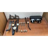 A pair of Julbo Spectron X2 sun glasses together with a collection of wristwatches etc