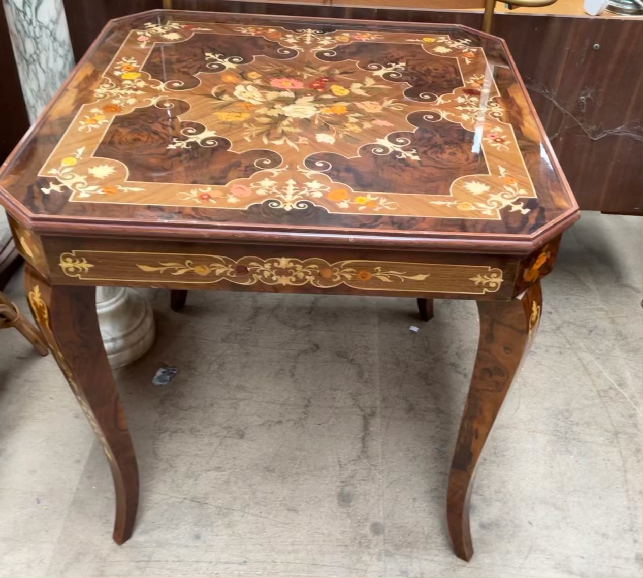 An inlaid Italian games table, with a removable top, revealing a backgammon board, chess board,