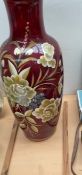 A large floral painted vase