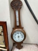An oak framed aneroid barometer,