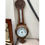 An oak framed aneroid barometer,