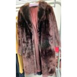 A brown faux fur coat