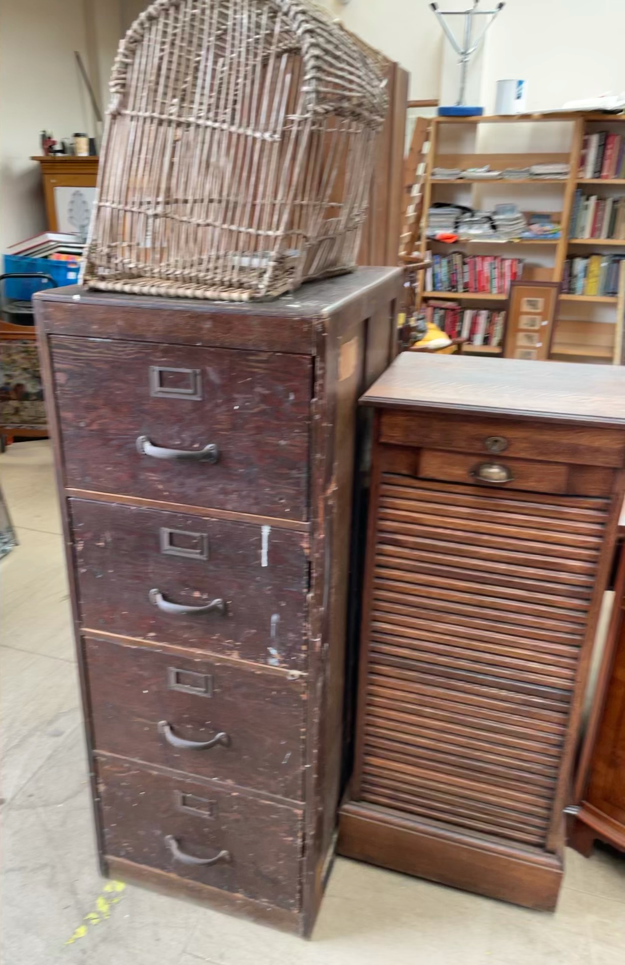 An oak tambour fronted filing cabinet together with another filing cabinet and a wicker basket