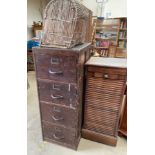 An oak tambour fronted filing cabinet together with another filing cabinet and a wicker basket