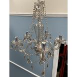 A glass lustre drop chandelier with eight branches together with another glass lustre drop