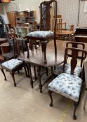 A 20th century oak drop leaf dining table together with a matched set of five Queen Anne style