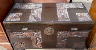 A carved Chinese camphor wood coffer,