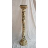 A marble tochere, the circular top above an ionic column on a circular base, 117cm high x 23.