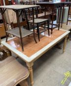 A modern tiled top dining table, on turned legs together with a bamboo occasional table,
