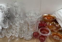 Carnival glass together with cranberry glass, glass decanters,