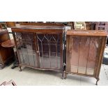 A 20th century mahogany display cabinet with a serpentine front,