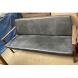 A mid 20th century teak settee with black leatherette upholstery on square legs CONDITION