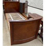 An Edwardian mahogany single bed