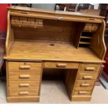 A Victorian style serpentine tambour fronted desk, by Country Desk,