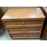 A teak effect chest,