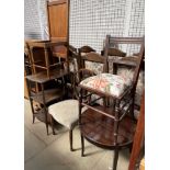 An Edwardian shield back chair together with two other chairs an occasional table and a three tier