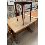 A 20th century oak extending dining table together with an early 20th century mahogany occasional