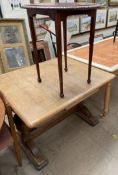 A 20th century oak extending dining table together with an early 20th century mahogany occasional