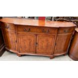 A 20th century yew sideboard