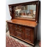 An Edwardian mahogany mirrorback sideboard with pierced decoration,