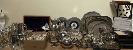 A large quantity of electroplated wares including goblets, tankards, cased and loose flatwares,