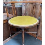 An early 20th century horseshoe shaped chair,