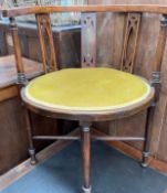 An early 20th century horseshoe shaped chair,