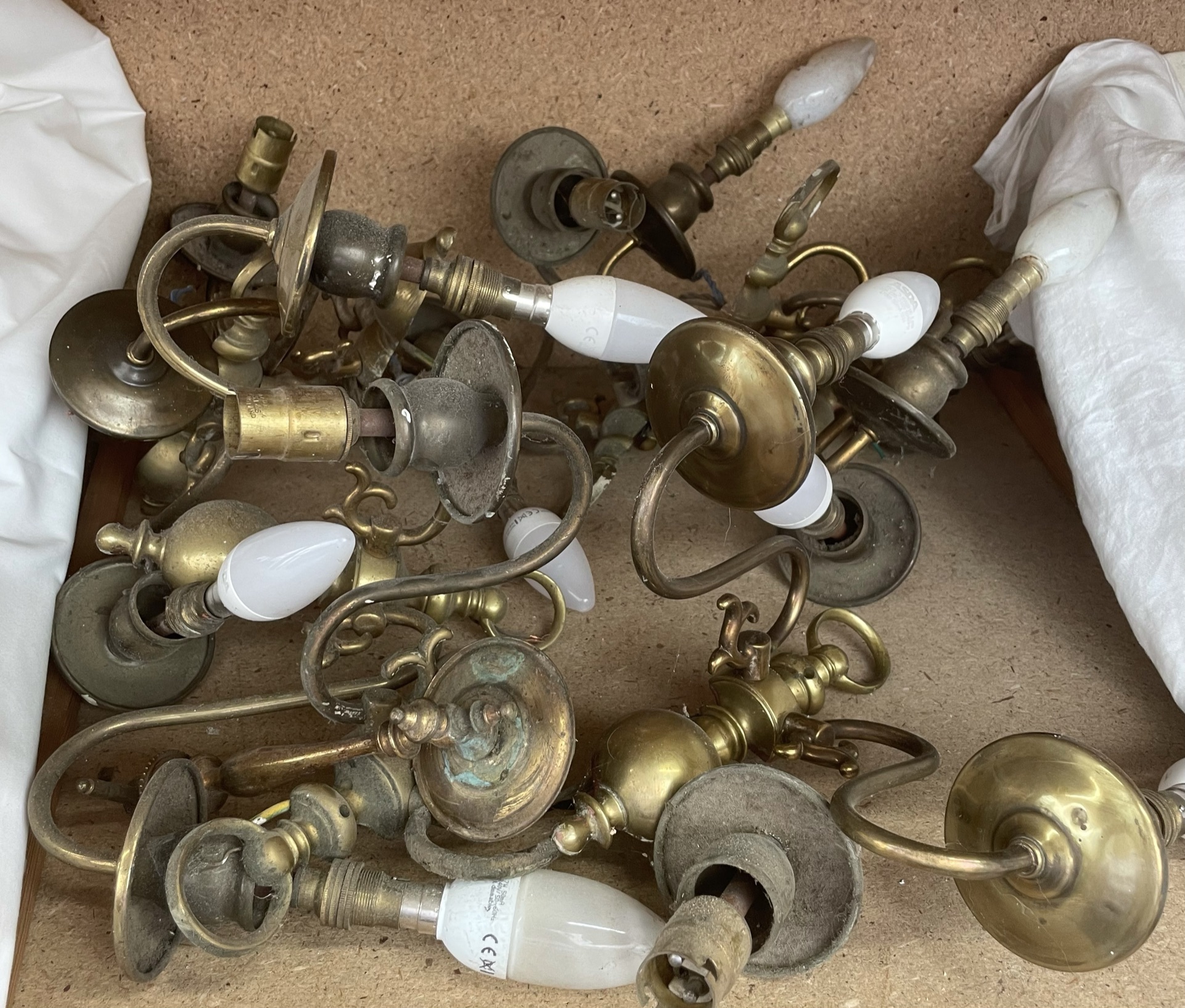 A collection of brass wall lights
