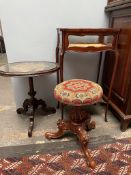 A Victorian walnut piano stool, the circular woolwork top on a reeded column and tripod base,