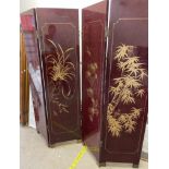 A Chinese lacquer four fold screen decorated with bamboo and birds etc