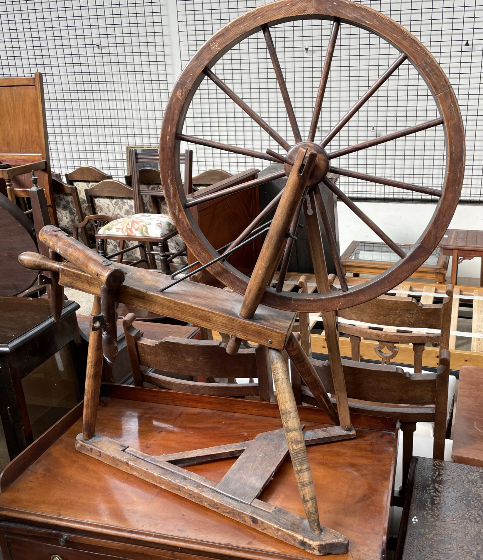 A spinning wheel with turned spindles