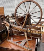 A spinning wheel with turned spindles