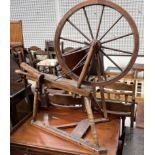 A spinning wheel with turned spindles