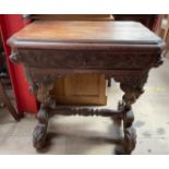 A 19th century Low Countries carved oak side table, carved with lions on scrolling feet,