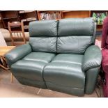 A Green leather two seater Timotion electric settee (Sold as seen,