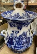 A large 19th century flo-blue pottery twin handled vase and cover