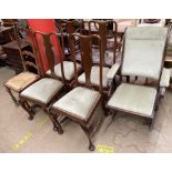 A campaign style folding elbow chair together with a set of four Queen Anne style dining chairs and